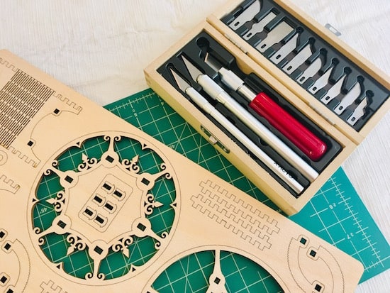 U Gears component tree beside an x-acto knife set.