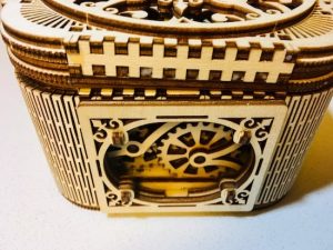 Left side of the the completed treasure box. An internal geared mechanism is exposed.