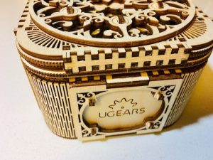 Front of the completed Treasure Box bears the UGears logo.