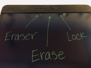 Closeup of the boogie board blackboard's pointing out the eraser button, the erase button, and the lock switch.
