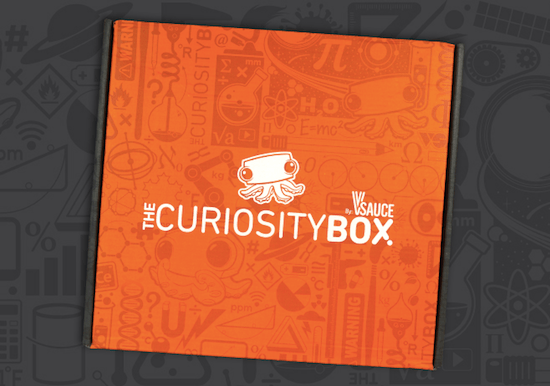 The orange Curiosity Box featuring an adorable octopus logo.