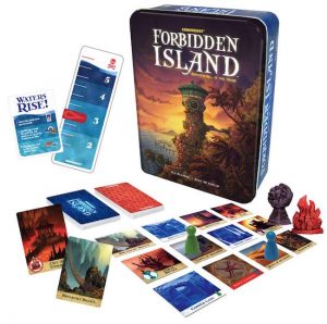Forbidden Island's box with an assortment of cards, location tiles, and pieces.