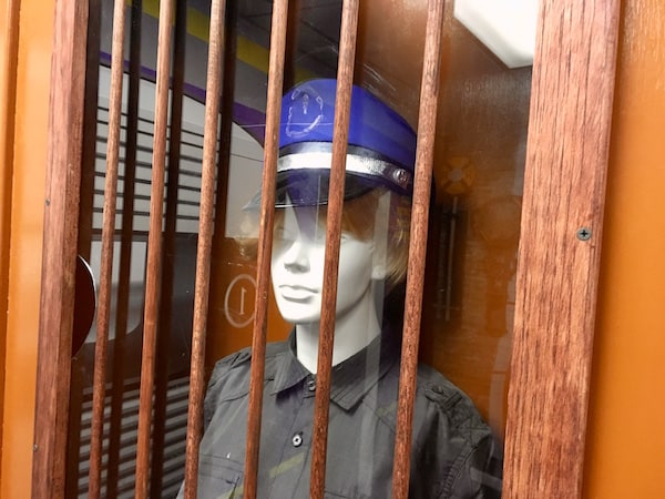 In-game: a ticket booth with a mannequin wearing a conductor's uniform.