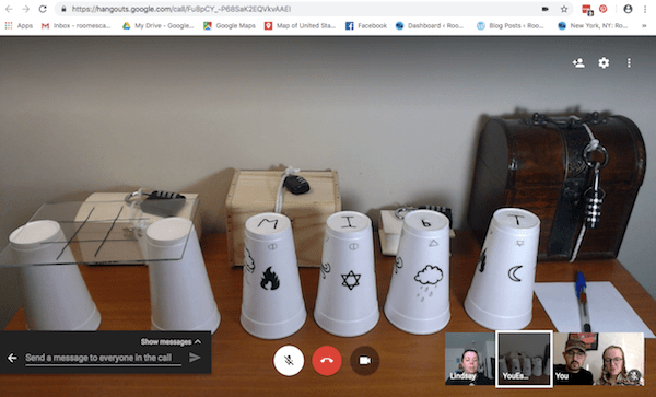 Google Hangout: The initial game setup features many locked boxes and styrofoam cups, some with drawings on them.