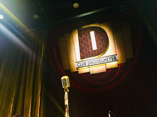 Club Drosselmeyer banner and microphone.