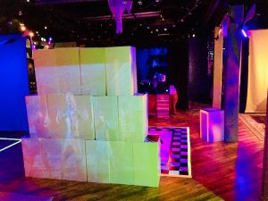 In-game: A wall of massive blocks in the middle of the room.