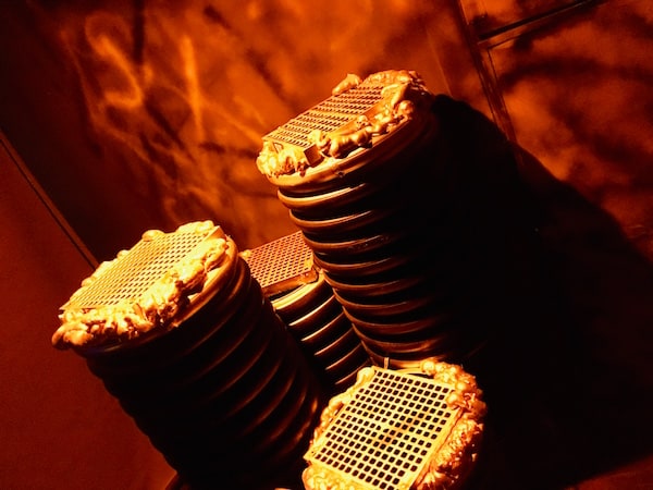 In-game: 4 large, vertical metal tubes with grates over them.