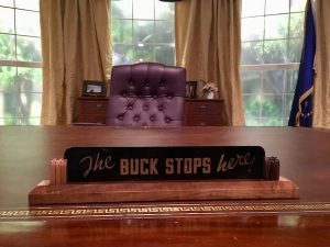 In-game: President Truman's "The BUCK STOPS here!" sign on the President's desk.
