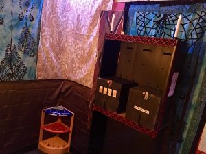 In-game: bookshelf with two locked boxes.