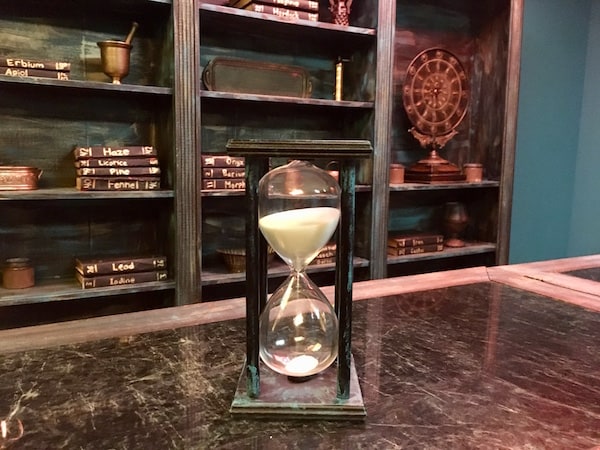 In-game: a large hourglass in the middle of the apothecary.