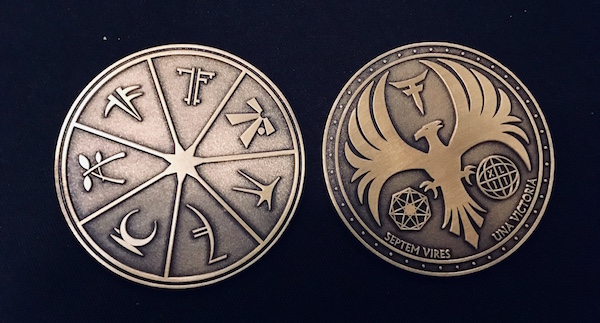 In-game: two sides of an ornate 7 Forces coin.