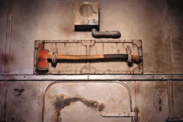 In-game: an axe hanging over a porthole.