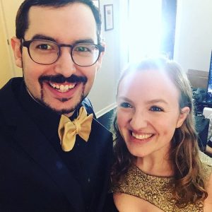 Lisa and David all dressed up in black and gold.