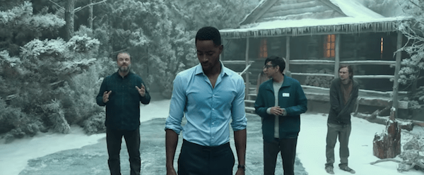 4 characters outside of a cabin in the middle of a snowy forest.