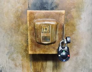 In-game: Closeup of a large electrical safety switch locked up a directional lock.