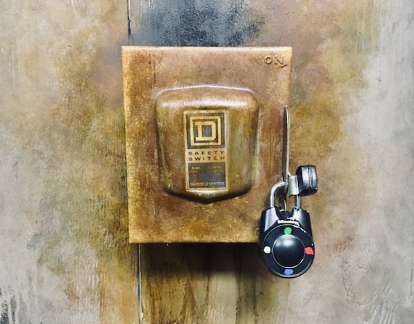 In-game: Closeup of a large electrical safety switch locked up a directional lock.