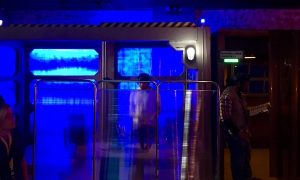 In-game: a blue glowing lab.