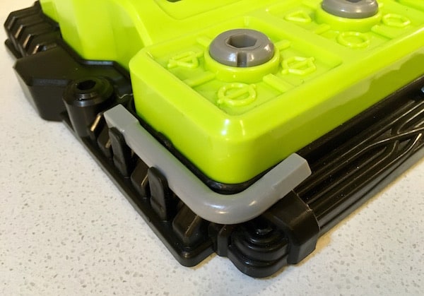 Closeup of an allen key attached to the corner of the device.