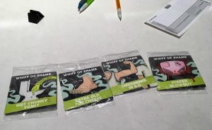 Whiff of shame cards featuring "Hot Chunky Vomit," "Extra Old Toe Cheese," "Smothered in B.O.," and "Diaper Blowout."