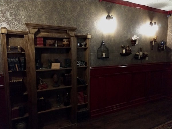 In-game: A bookcase filled with old books and trinkets.