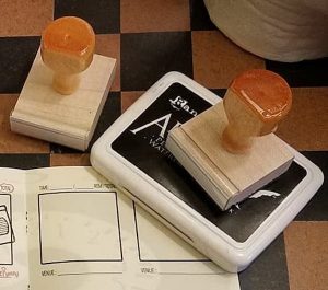 Stamps resting on an open passport.