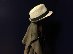 In-game: A trench coat and fedora on a coatrack.