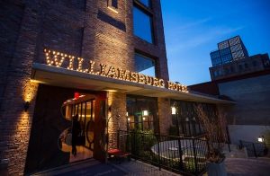 The Williamsburg Hotel lit at night.