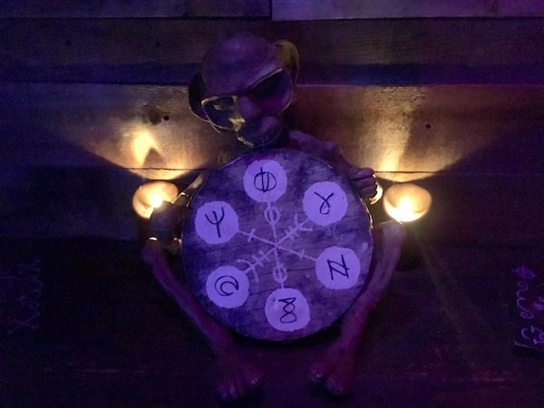 In-game: a small creature holding a talisman.