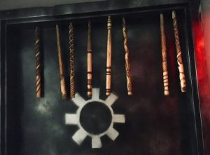 In-game: 8 magic wands hanging from the top of a doorway.