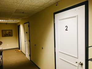 In-game: The hallway for an apartment building.