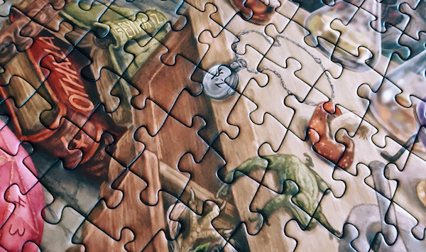 Portion of an assembled jigsaw puzzle featuring a magical books and ingredients.