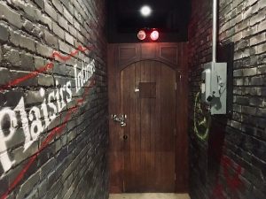 In-game: a back-alley behind a bar.