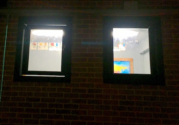 In-game: A view into a classroom from the outside of the school.