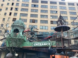 The entrance beneath a massive series of strange structures to climb on.
