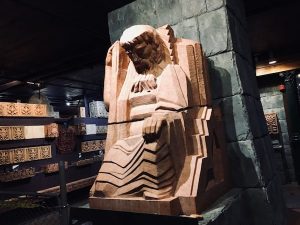 A massive art deco sculpture of a man.