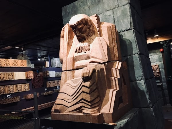 A massive art deco sculpture of a man.