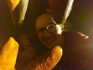 Lisa crawling through the jaw of a great stone beast.