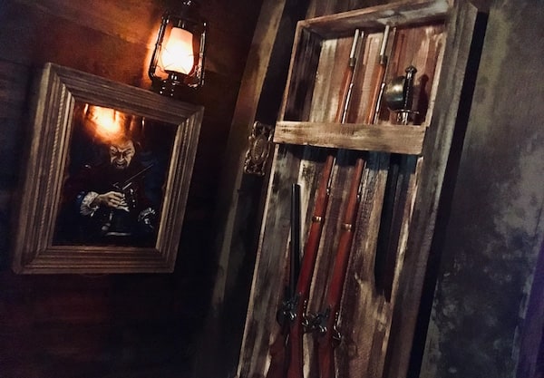 In-game: A wrack filled with muskets and swords.