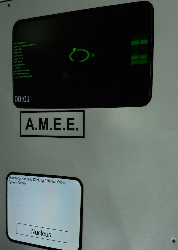 In-game: A computer console labeled "A.M.E.E."