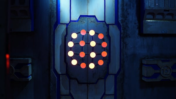 In-game: A matrix of glowing dots on a door.
