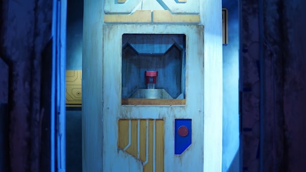 In-game: A storage device with a red object within it.