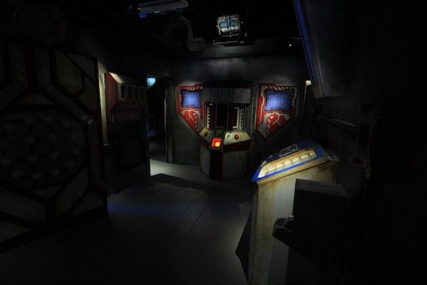 In-game: Wide angle shot of a control room.