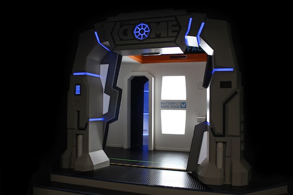 In-game: The entry way for The Dome opened, a sign reads, "Butterfly Safe Zone.".