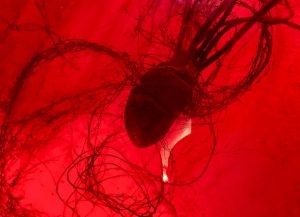 In-game: a red heart beating in a sea of blood.