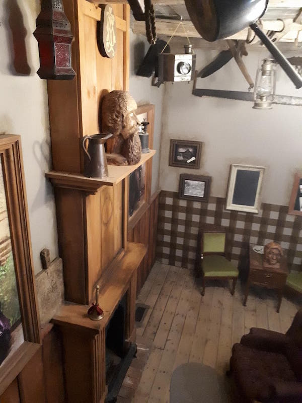 In-game: A wall of antiques shot from high up.