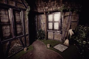 In-game: The exterior of a beautiful old home that shows signs of disrepair.