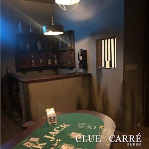 In-game: A bar beside a blackjack table in a back room casino.