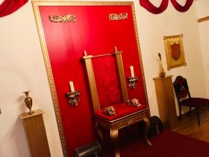 In-game: A red and gold throne room.