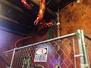 In-game: An interesting room with octopus tenticles reaching in through porthole windows.