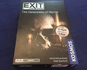 Exit: The Game Catacombs of Horror box art featuring a skull, and lit candle.